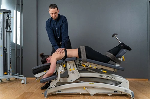 patient on Manuthera 242 Manual Therapy Table